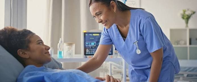 A doctor reassuring a patient during a calm consultation