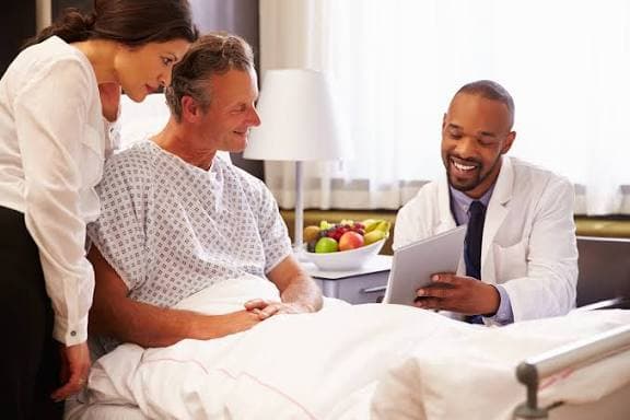 A doctor reviewing options with a patient during a calm consultation